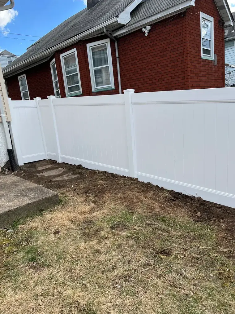 Vinyl Privacy Fence at a Brick House